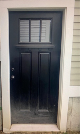 Image of a black side door submitted as a proof-of-delivery photo
